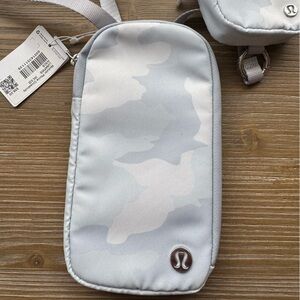 Lululemon crossbody phone and AirPod bag. White camo. New with tags.